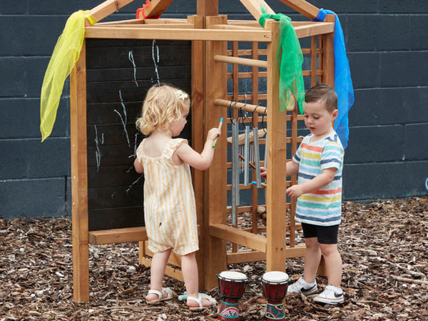 Children playing outside with furniture from Cosy